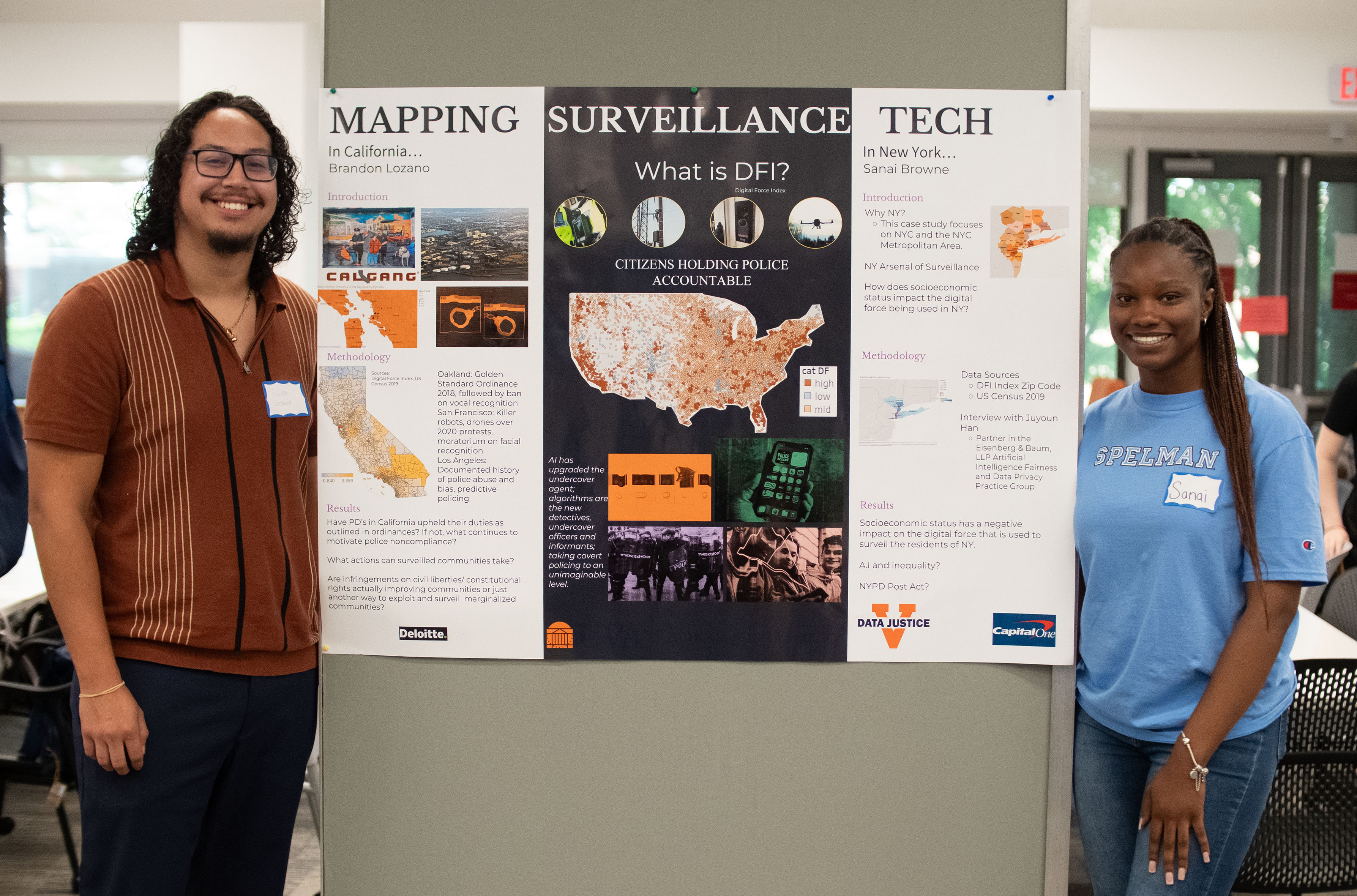 Two students and their poster presentation
