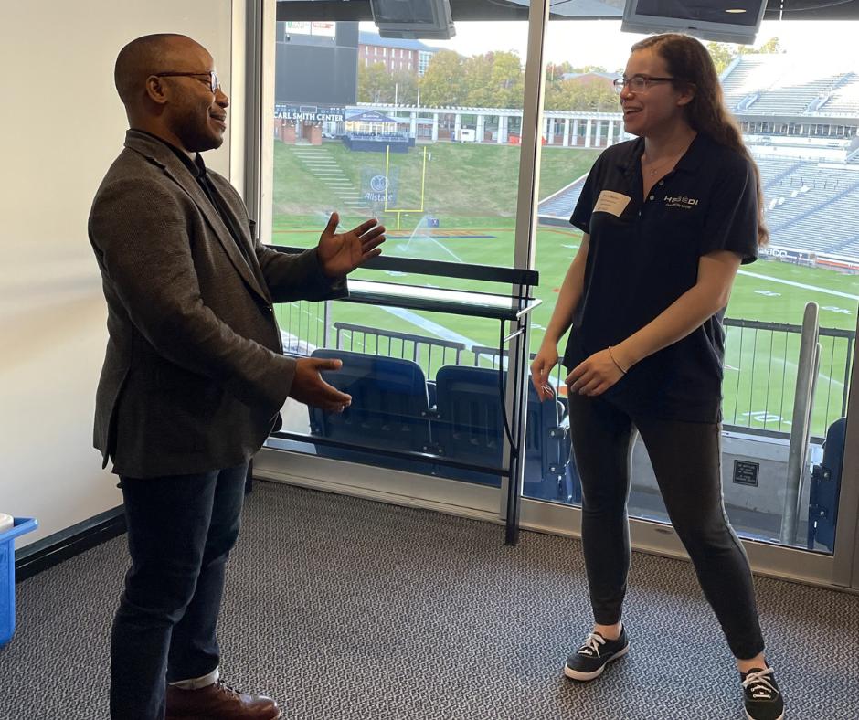 Reggie Leonard, associate director for career connections and community engagement for the School of Data Science and Claire Dozier, Intermediate Data Analyst at The MITRE Corporation having a conversation