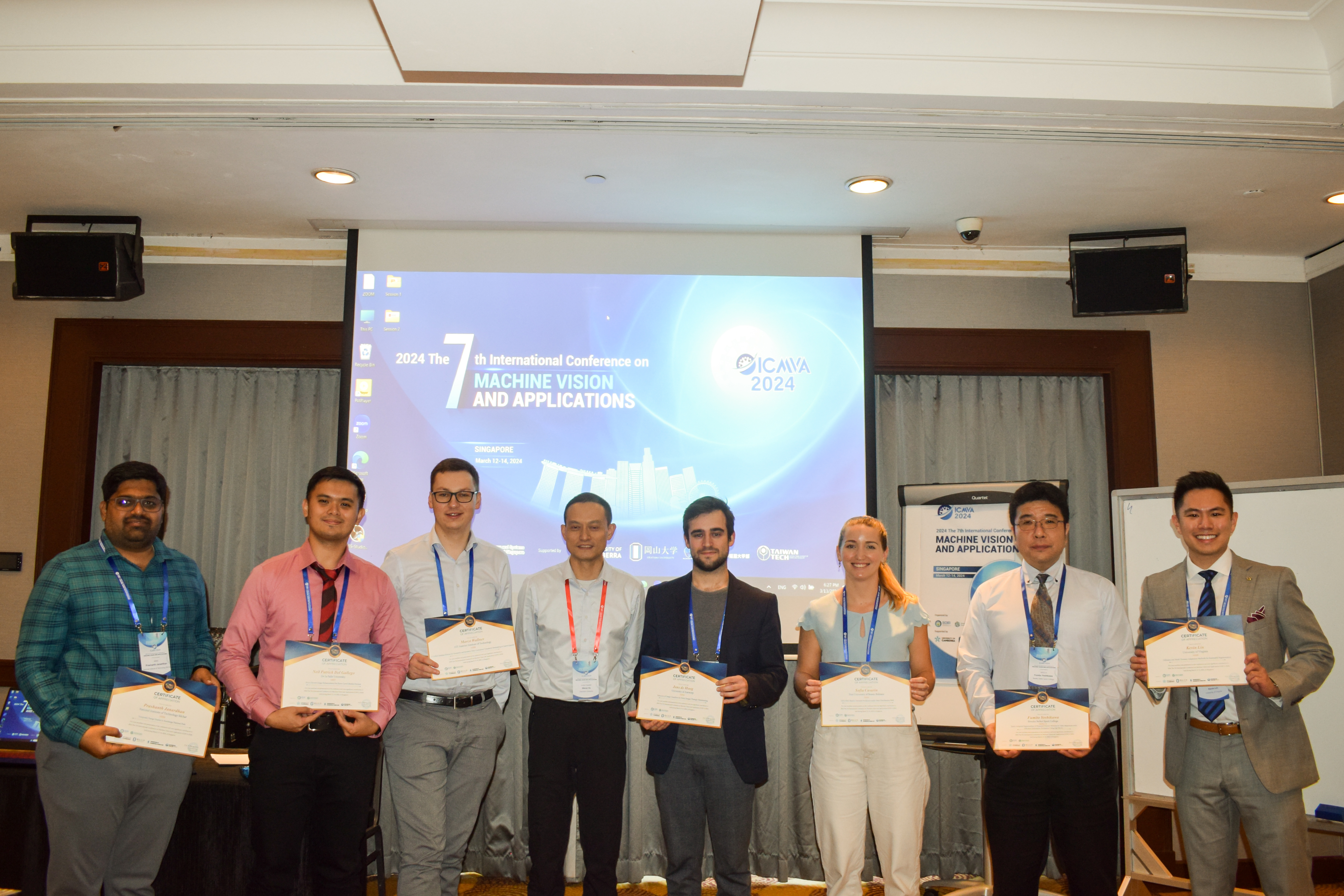 Data Science PhD Candidate Kevin Lin and others receiving awards at the International Conference on Machine Vision and Applications in Singapore