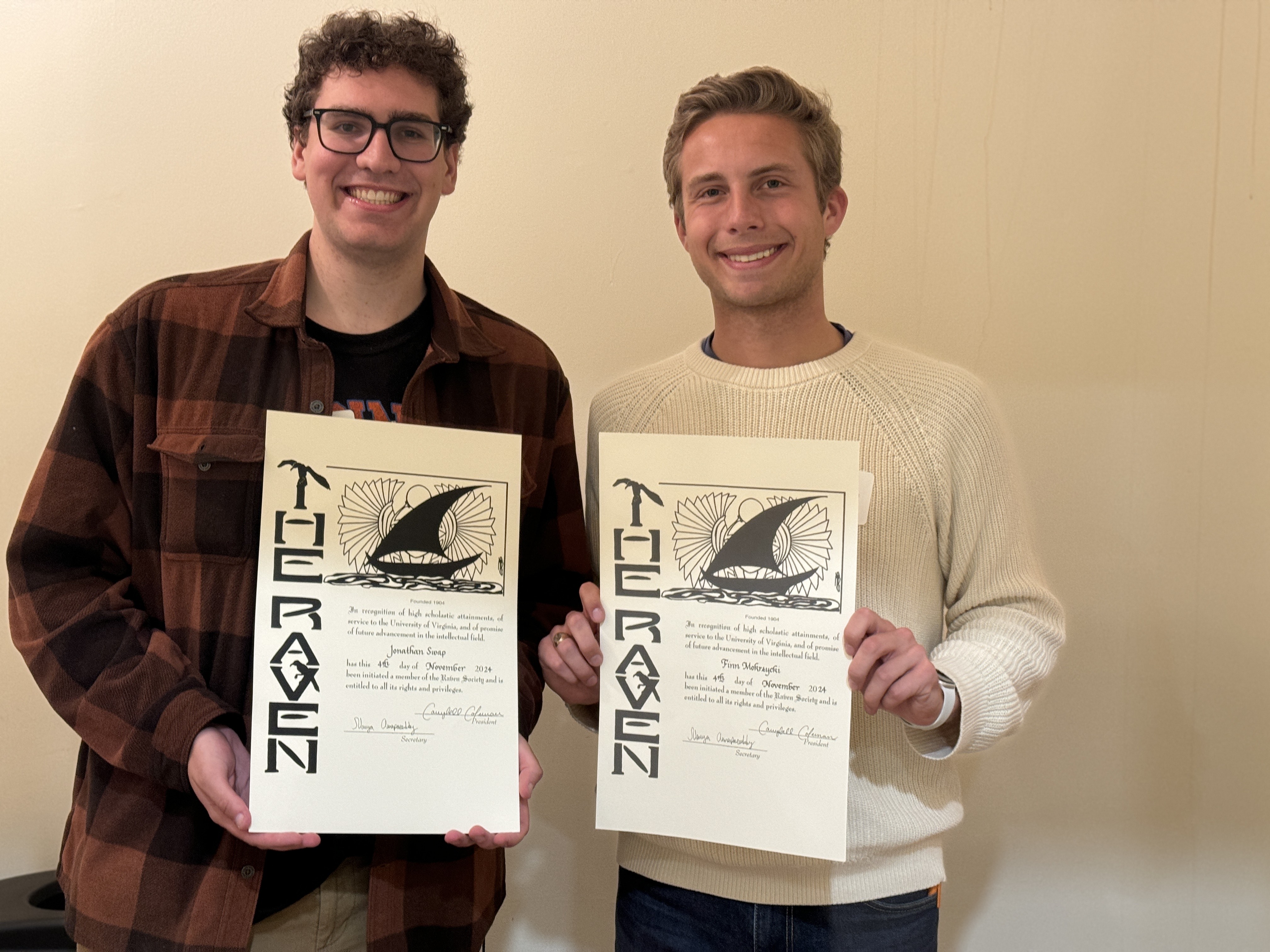 UVA Data Science MSDS students stand side by side holding their signed induction certificates