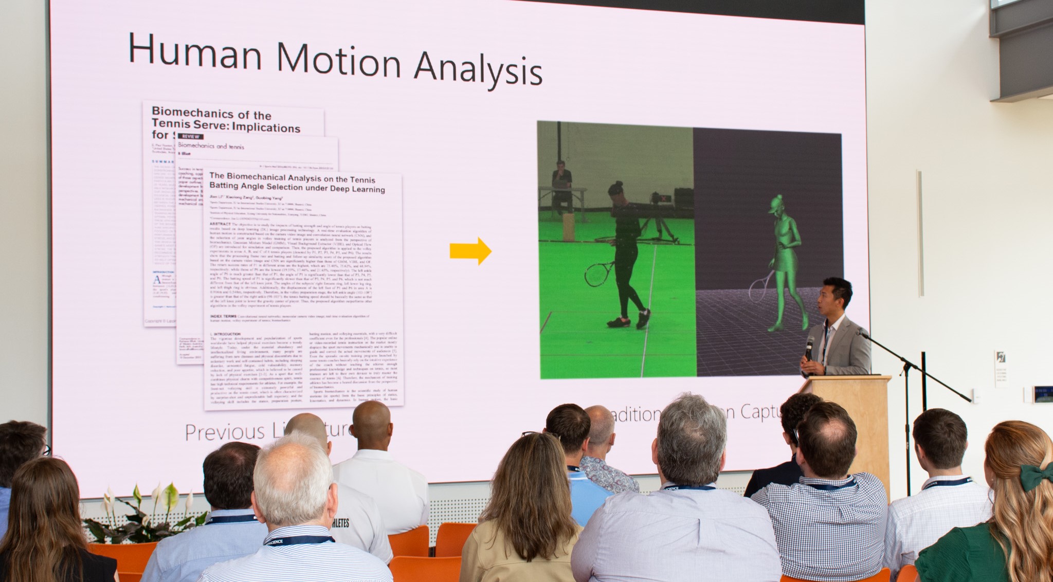 Photo of Jason Wang presenting research on biomechanics in tennis.