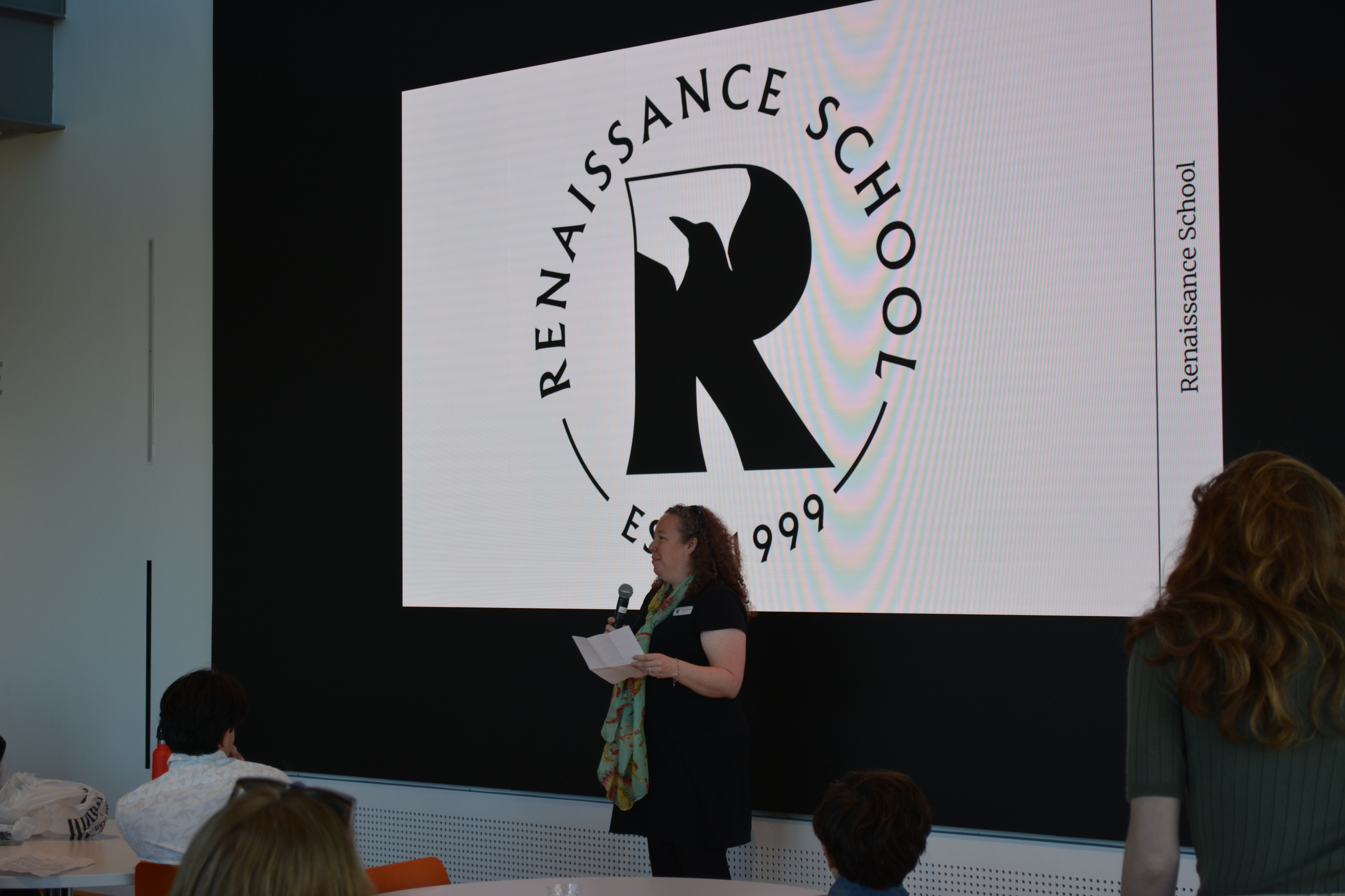 Renaissance School Dean of Academics Bethany Farris addresses the room