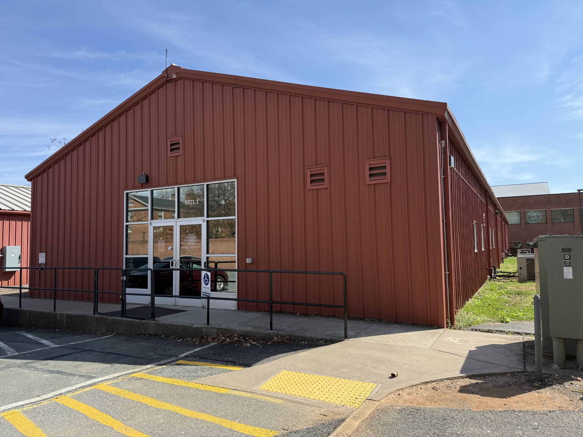 A red temporary building that used to house the Data Science Institute.