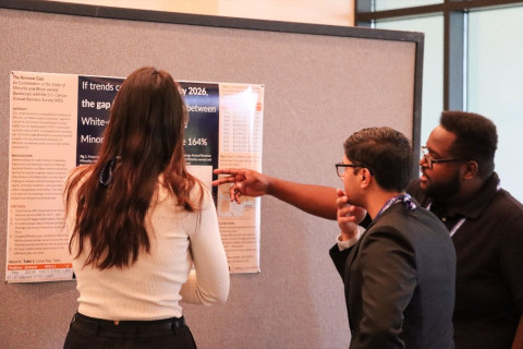 Data Science students discuss their poster presentation