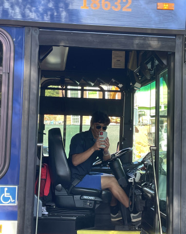 UVA data science student Bernard Gonzales on the bus he drives