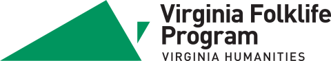 Logo for Virginia Folklife Program. Simple green triangle with smaller triangle on the right that resembles shape of Virginia. Text reads "Virginia Folklife Program, Virginia Humanities"