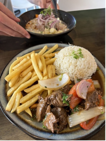 Inca Peruvian meal plate with rice, fries, veg and meat