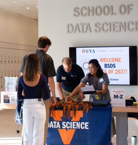 Data science majors check in for their orientation at the School of Data Science Building.