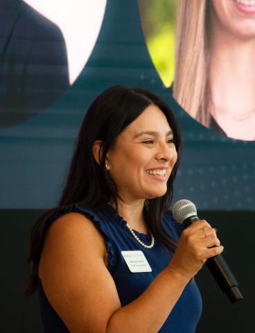 UVA Data Science Student Success Advisor Heather Corley speaking at orientation with a microphone