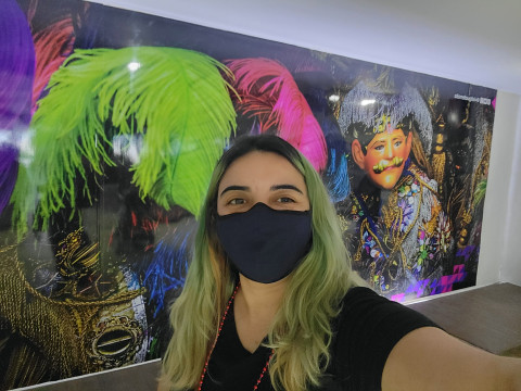 UVA Data Science online master's student Andrea Jabocs takes a selfie in the Guatamala City airport in front of colorful art