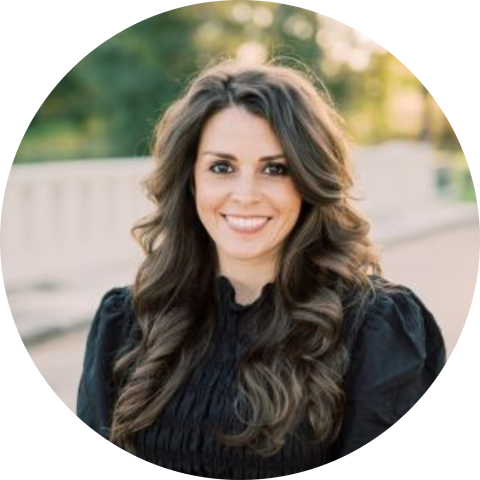 Kelly Ard in black outfit outside in professional headshot circle crop