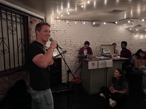 UVa Data Science MSDS online student Addison Nitto emceeing at SoFar Sounds in NYC