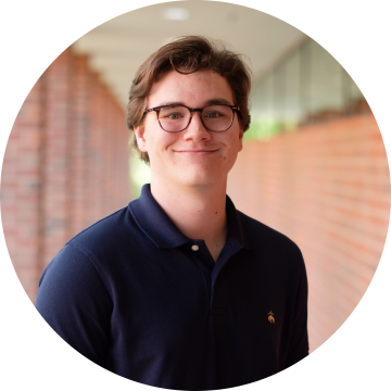 Ph.D Student Ethan Nelson smiles for the camera.