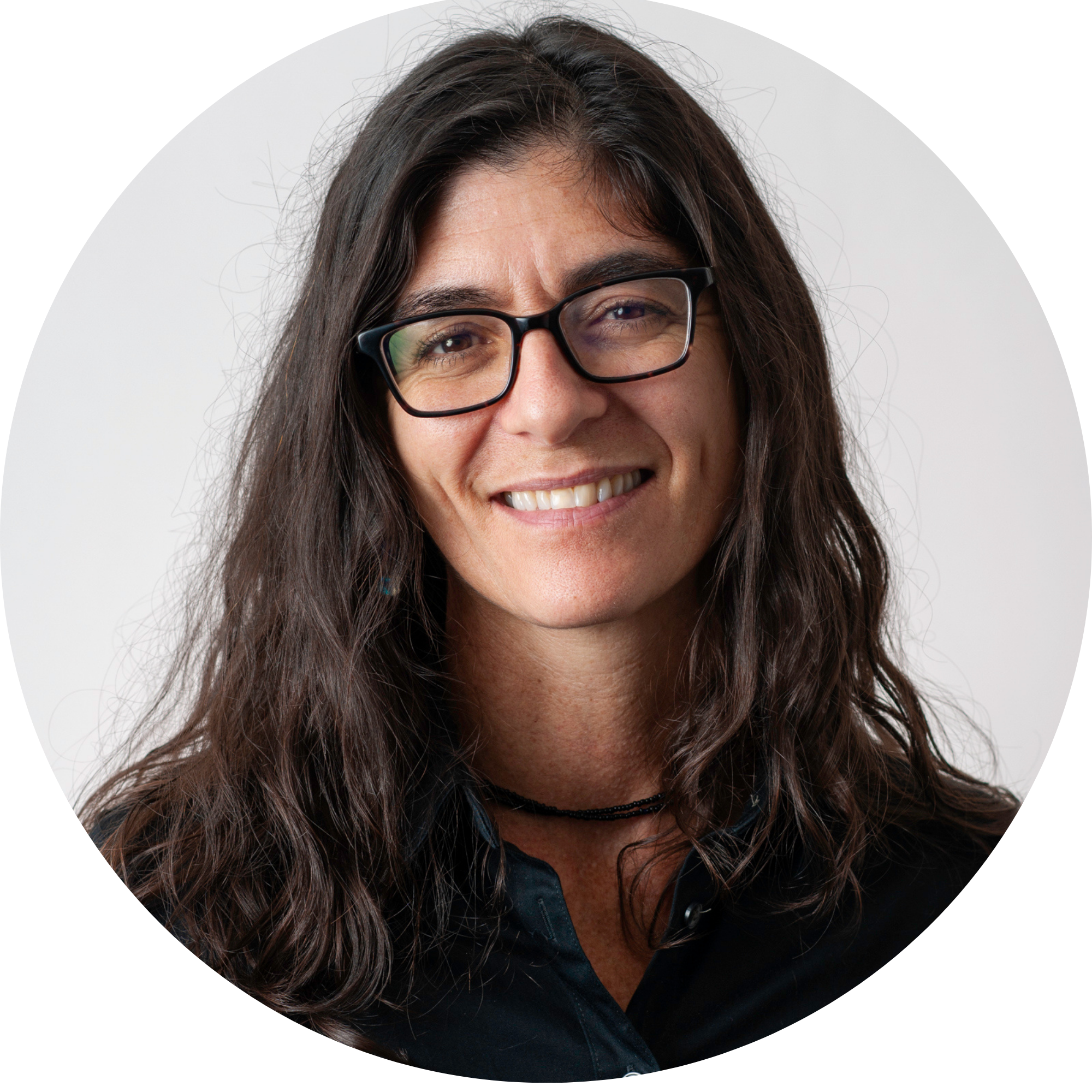 Headshot of Rachel Saidi wearing glasses and a black button up shirt.