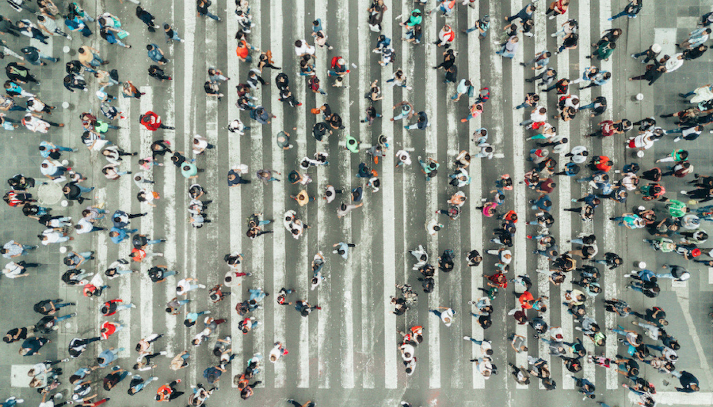 aerial view of people crossing street
