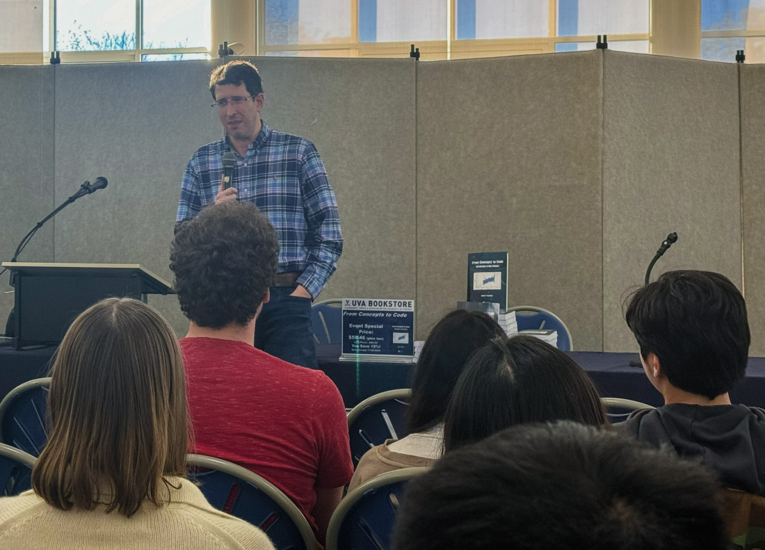 Professor Adam Tashman addresses an audience during his book signing.