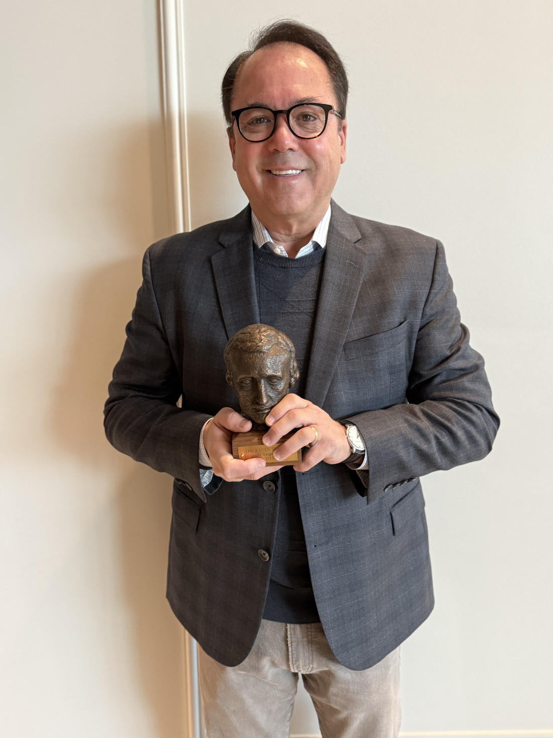 Photo of Scott Stephenson receiving his Alumni Raven Award.
