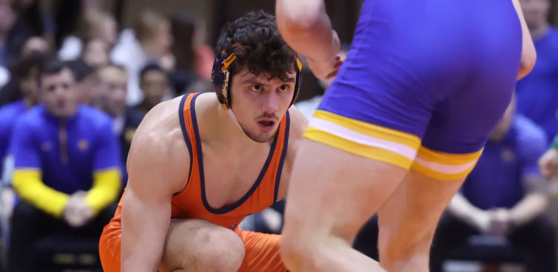 UVA Wrestler in crouch position during match