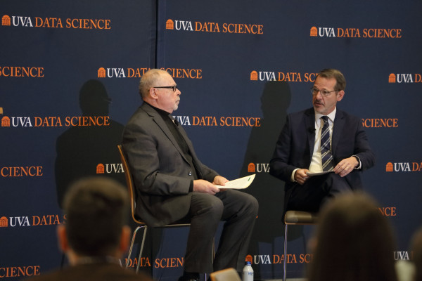 Phil Bourne, dean of the School of Data Science, left, and Ian Baucom, UVA's executive vice president and provost, announce the launch of the Futures Initiative at Datapalooza. 