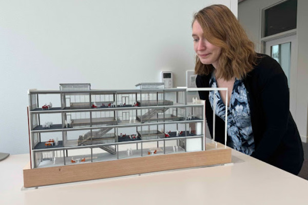 Molly Porter and the model she built of the new Data Science building. 