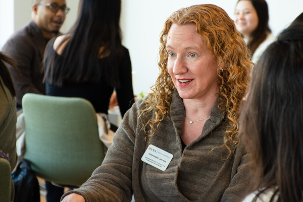 UVA Data Science Assistant Director, Career and Professional Development seated at a table with students