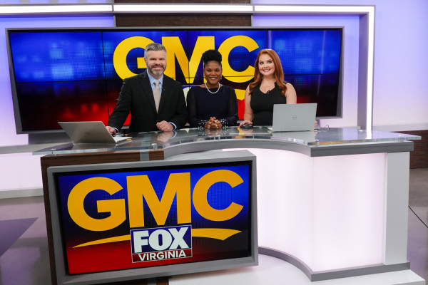 Dr. Jade Preston with two CBS19 anchors at a news desk.