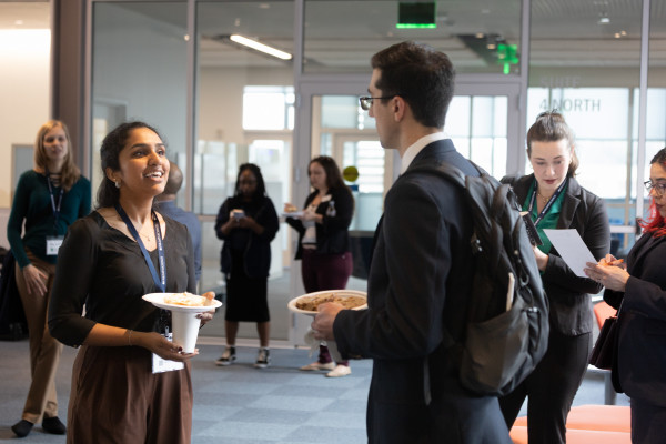 Photo of MSDS students gathered at the School of Data for a networking breakfast. 